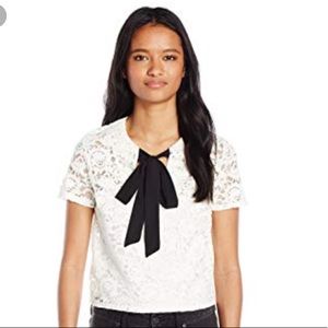 White crop lace top with black tie in the front